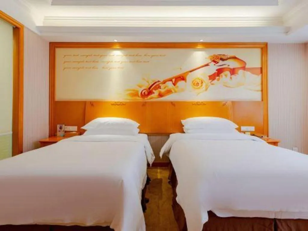 Bed in Vienna International Hotel Kunming Guangfu Road Aegean Shopping Center