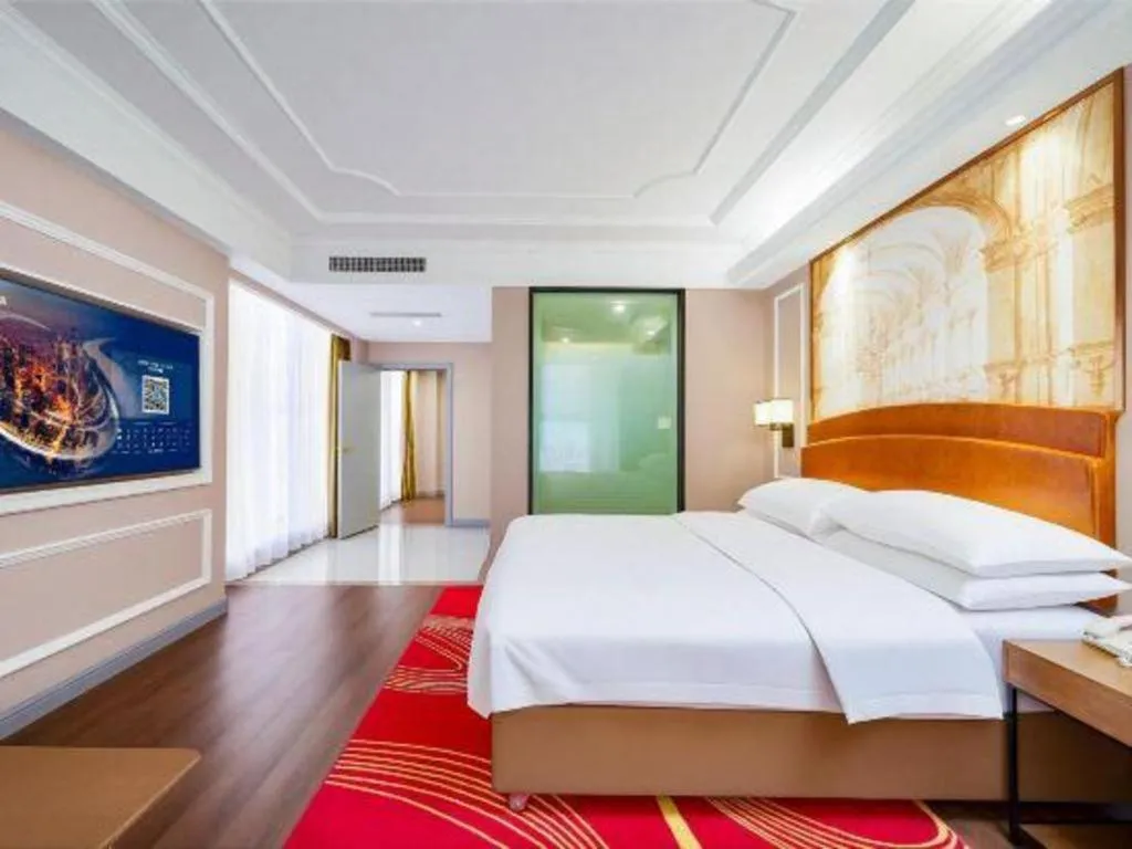 Bed in Vienna International Hotel Kunming Guangfu Road Aegean Shopping Center