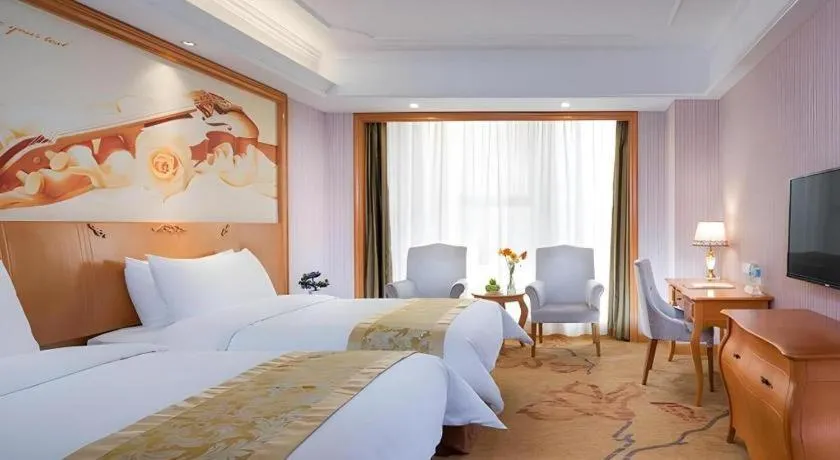 Bed in Vienna International Hotel Kunming Guangfu Road Aegean Shopping Center