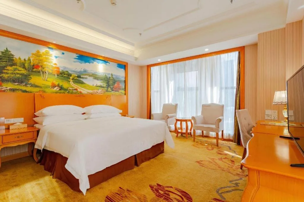 Bed in Vienna International Hotel Kunming Guangfu Road Aegean Shopping Center