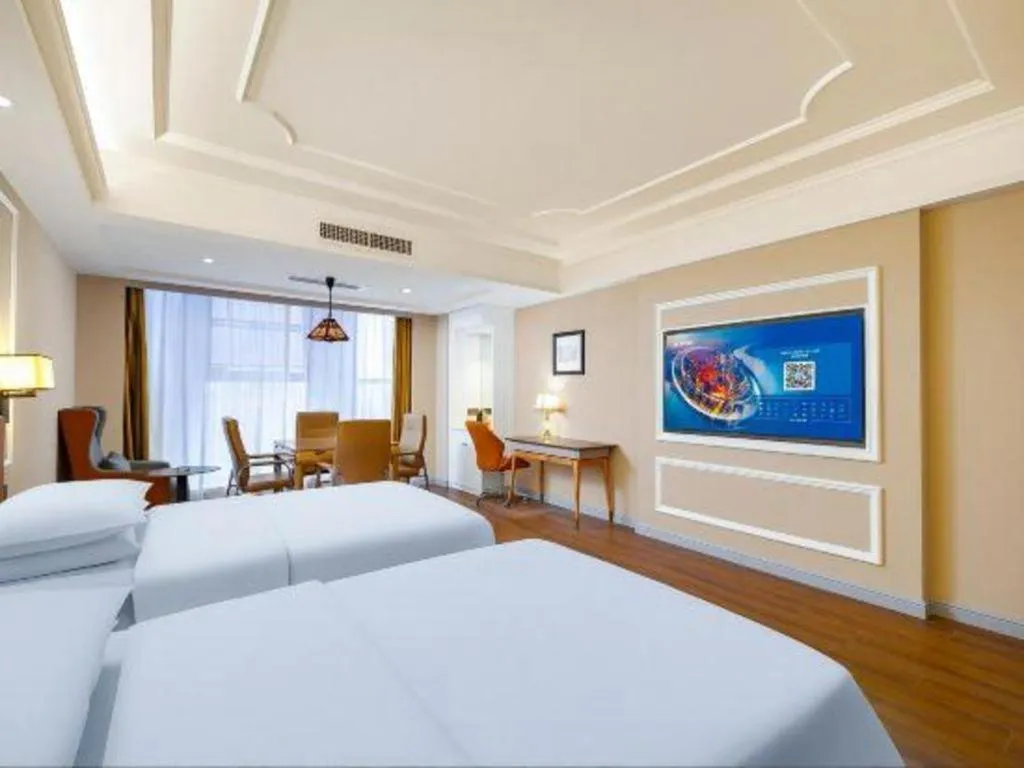 Bed in Vienna International Hotel Kunming Guangfu Road Aegean Shopping Center