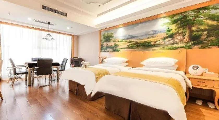 Bed in Vienna International Hotel Kunming Guangfu Road Aegean Shopping Center