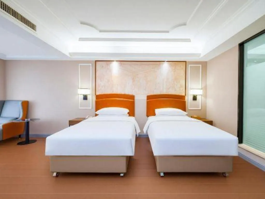Bed in Vienna International Hotel Kunming Guangfu Road Aegean Shopping Center