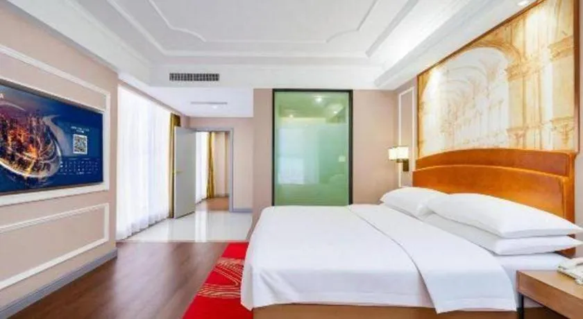 Bed in Vienna International Hotel Kunming Guangfu Road Aegean Shopping Center