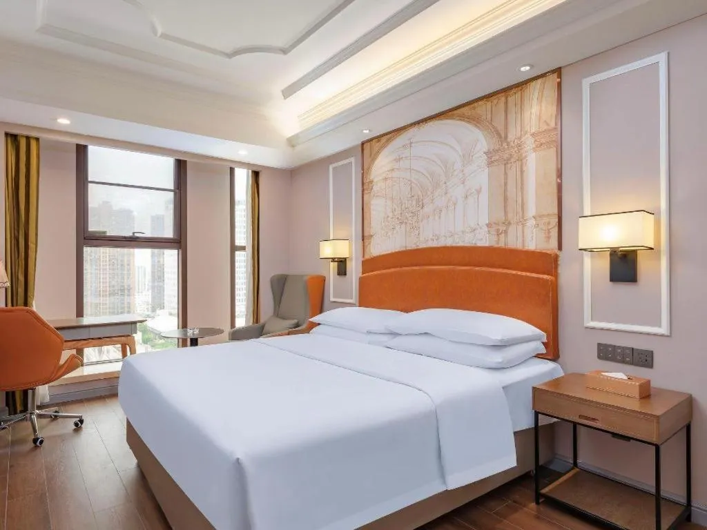 Bed in Vienna International Hotel Kunming Guangfu Road Aegean Shopping Center