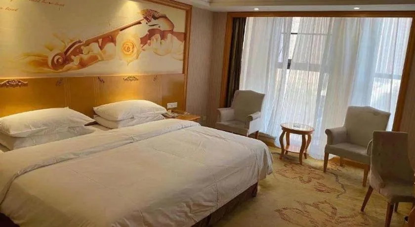 Bed in Vienna International Hotel Kunming Guangfu Road Aegean Shopping Center