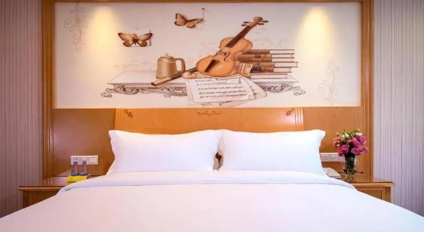 Bed in Vienna International Hotel Kunming Guangfu Road Aegean Shopping Center