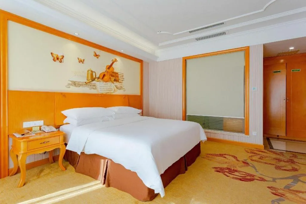 Bed in Vienna International Hotel Kunming Guangfu Road Aegean Shopping Center