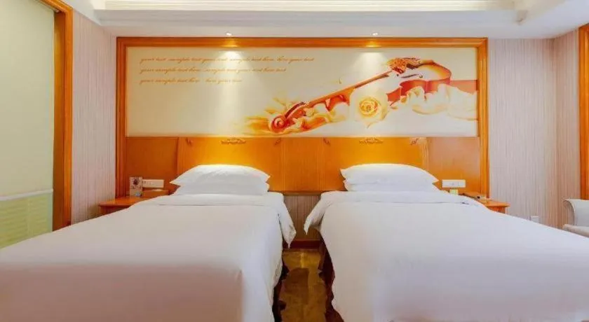 Bed in Vienna International Hotel Kunming Guangfu Road Aegean Shopping Center