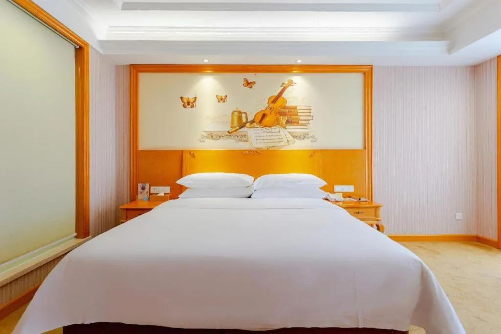 Bed in Vienna International Hotel Kunming Guangfu Road Aegean Shopping Center