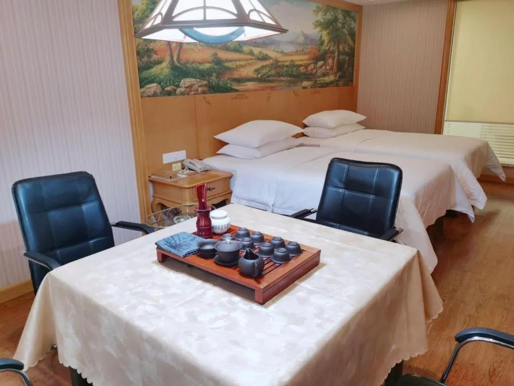 Bed in Vienna International Hotel Kunming Guangfu Road Aegean Shopping Center