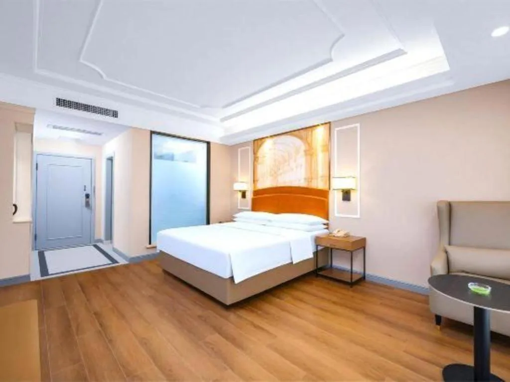 Bed in Vienna International Hotel Kunming Guangfu Road Aegean Shopping Center