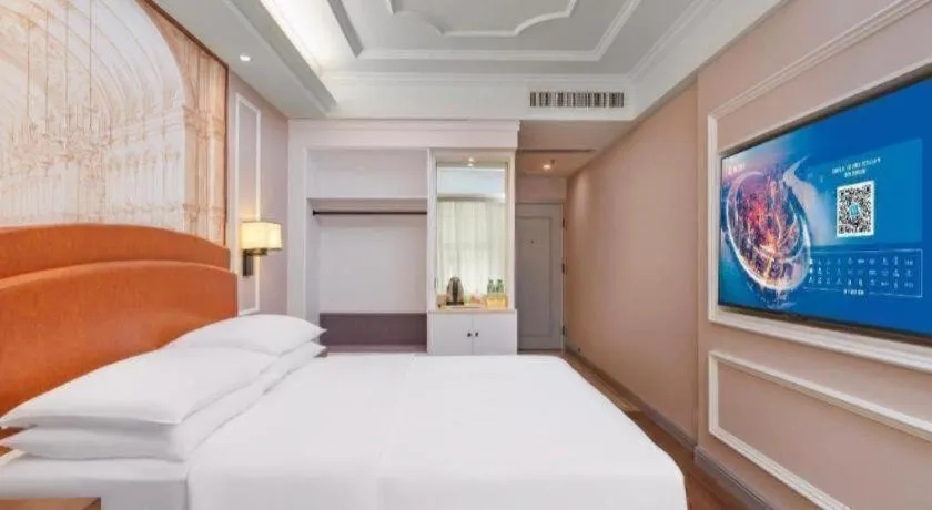 Bed in Vienna International Hotel Kunming Guangfu Road Aegean Shopping Center