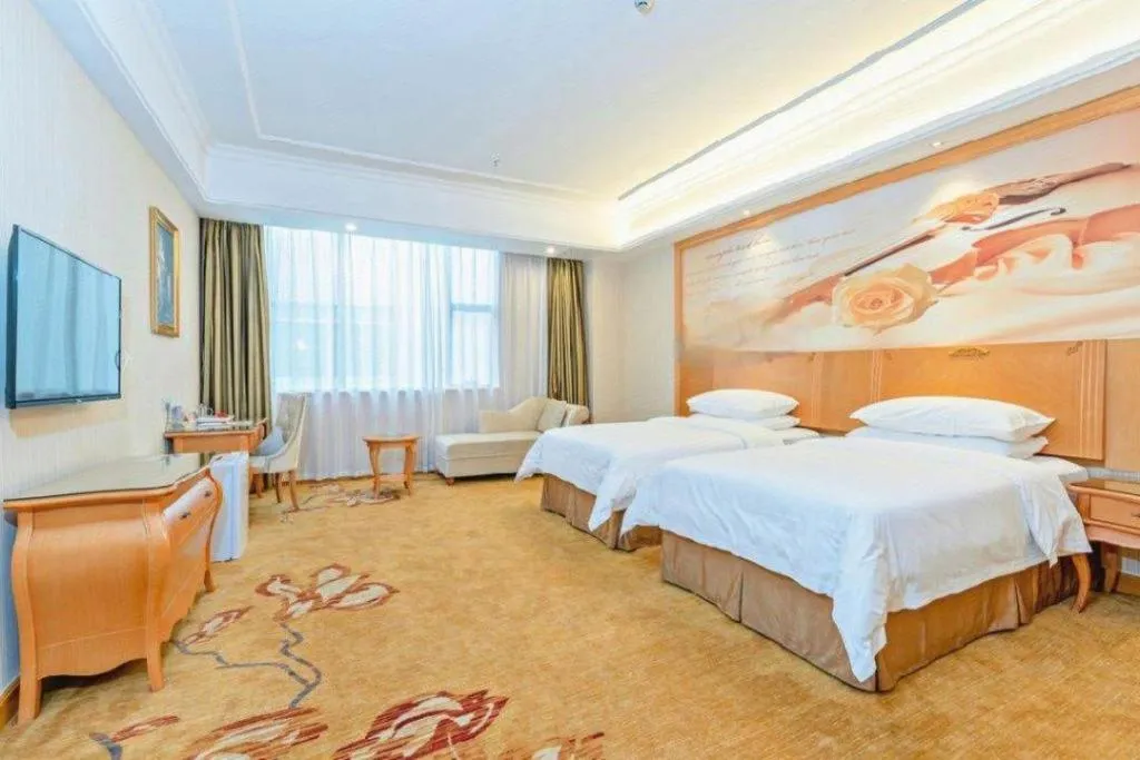 Bed in Vienna Hotel Guangzhou Airport Gaosu Pingsha