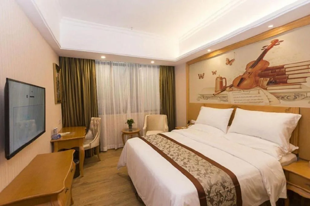 Bed in Vienna Hotel Guangzhou Airport Gaosu Pingsha