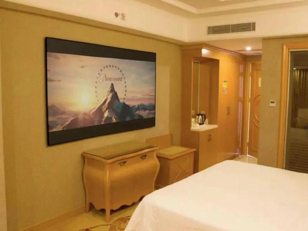 Bed in Vienna Hotel Guangzhou Airport Gaosu Pingsha