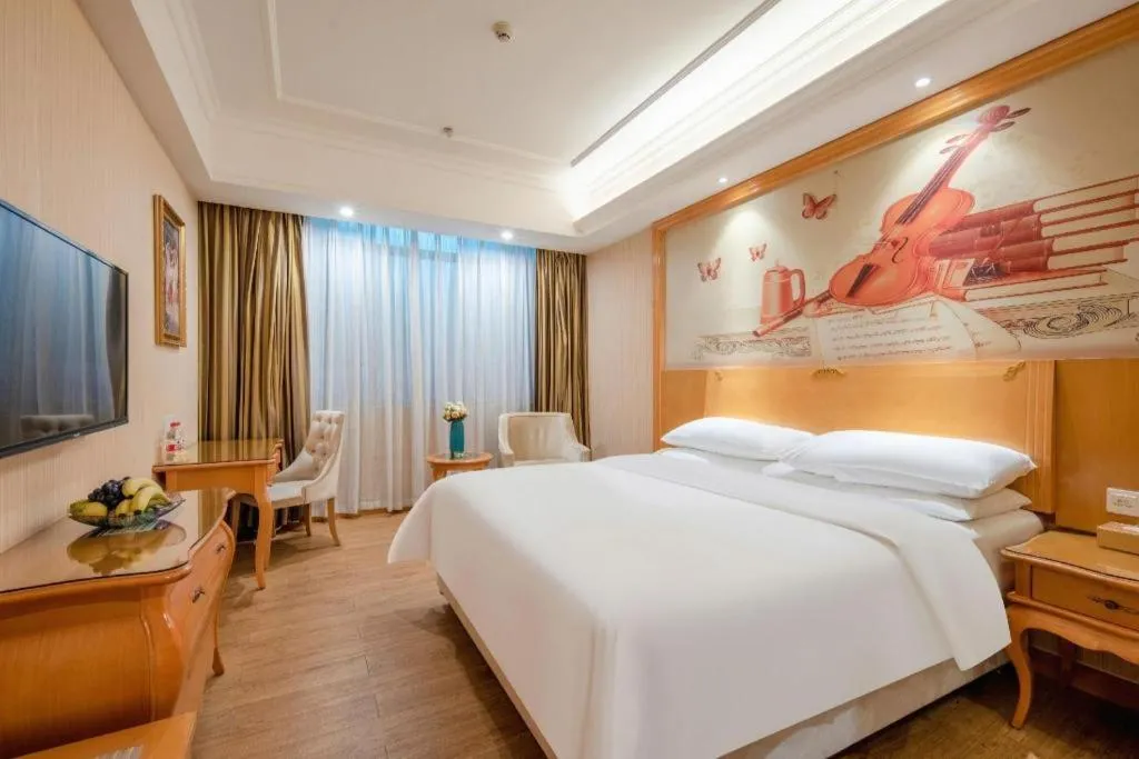 Bed in Vienna Hotel Guangzhou Airport Gaosu Pingsha