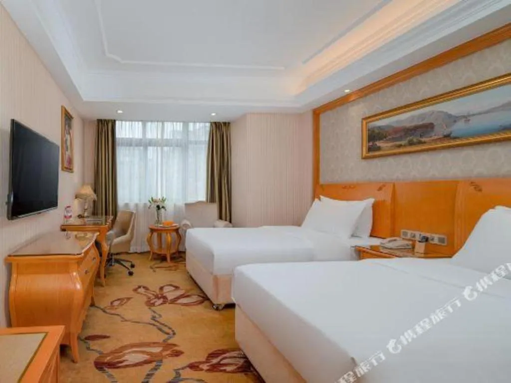Bed in Vienna Hotel Chengdu Airport Shuangliu Wanda