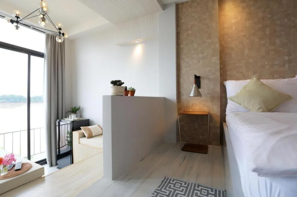 Bed in The River House Chiangkhan Hotel