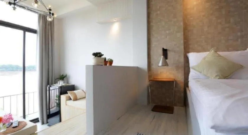 Bed in The River House Chiangkhan Hotel