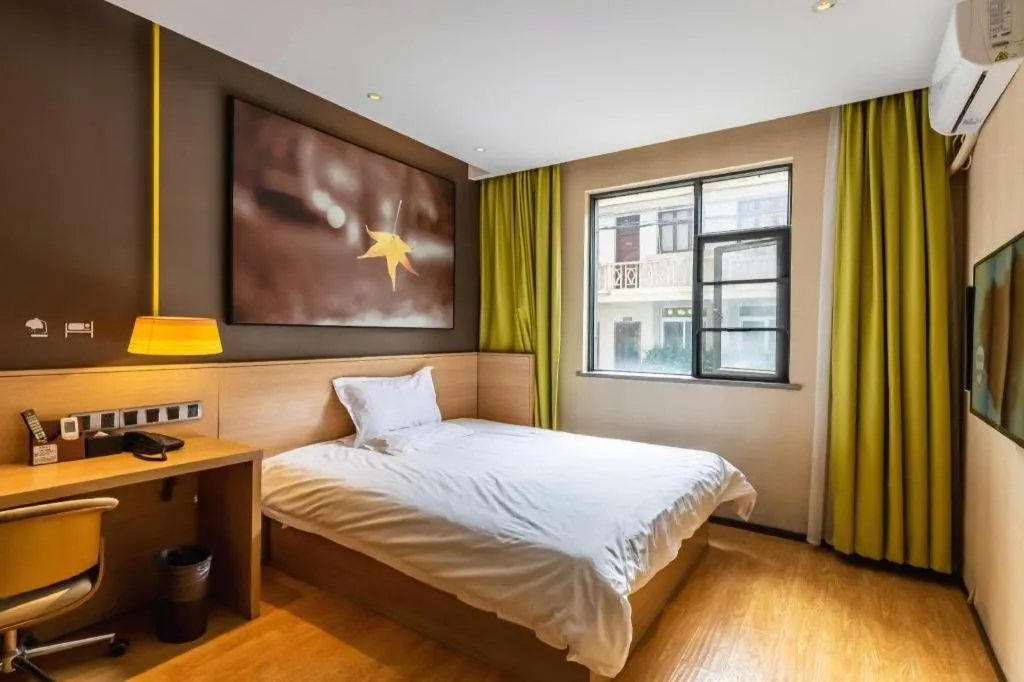 Bed in IU Hotel Kunming Jinma Bijifang Joy City