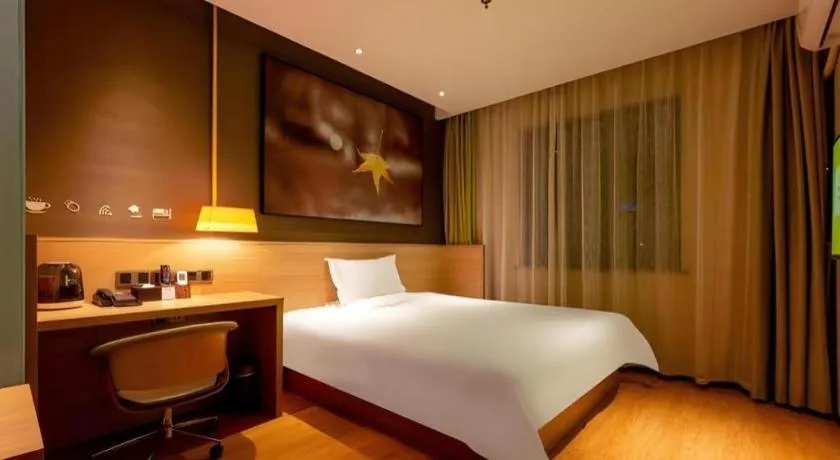 Bed in IU Hotel Kunming Jinma Bijifang Joy City