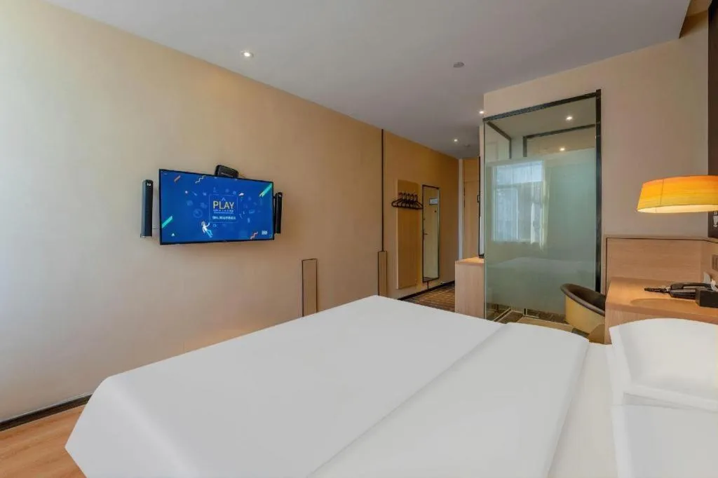 Bed in IU Hotels Xinzhou Bus Terminal