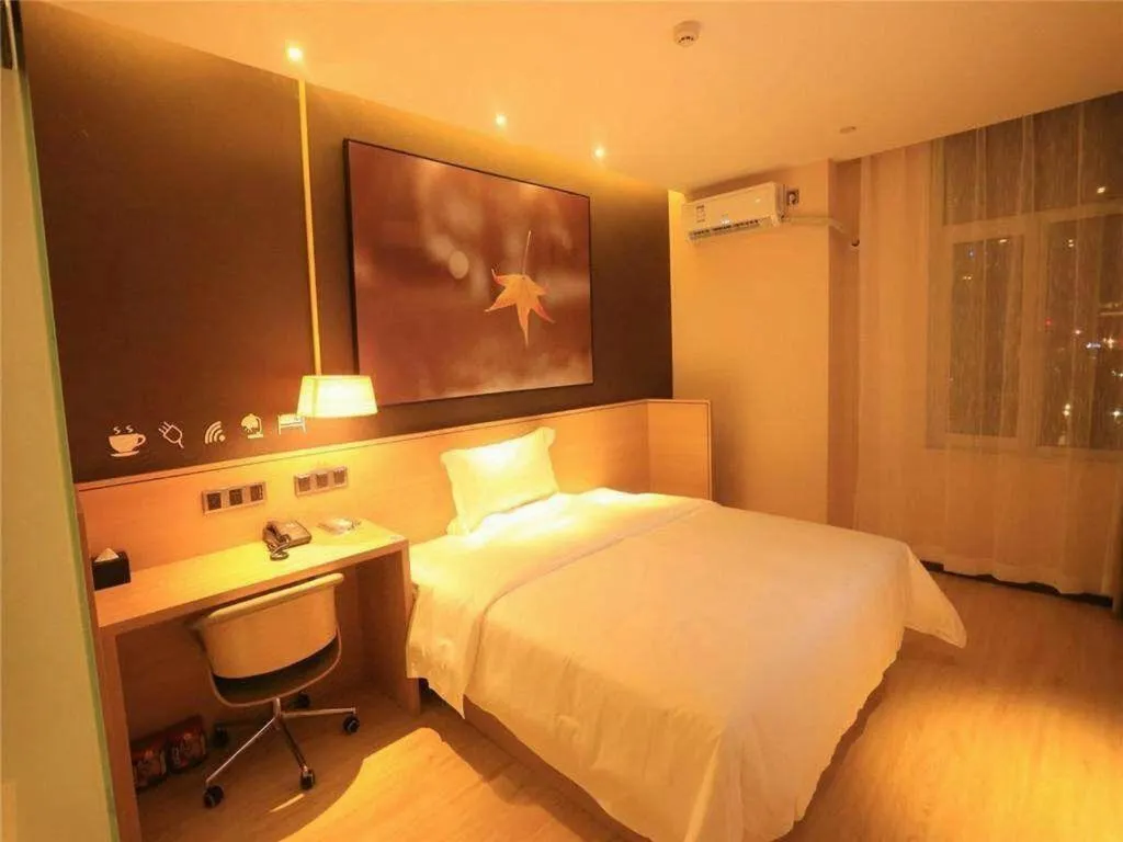 Bed in IU Hotels Xinzhou Bus Terminal