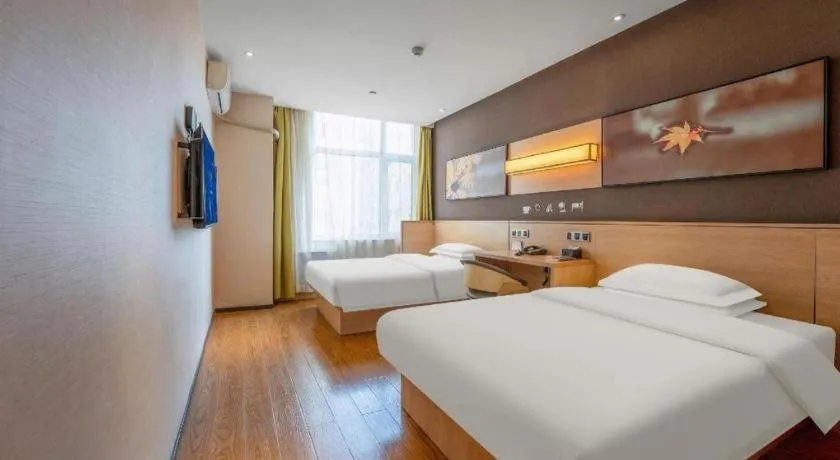 Bed in IU Hotels Xinzhou Bus Terminal