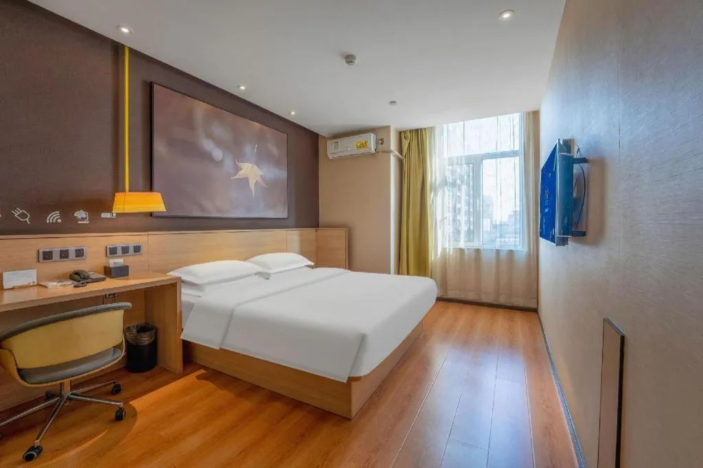 Bed in IU Hotels Xinzhou Bus Terminal