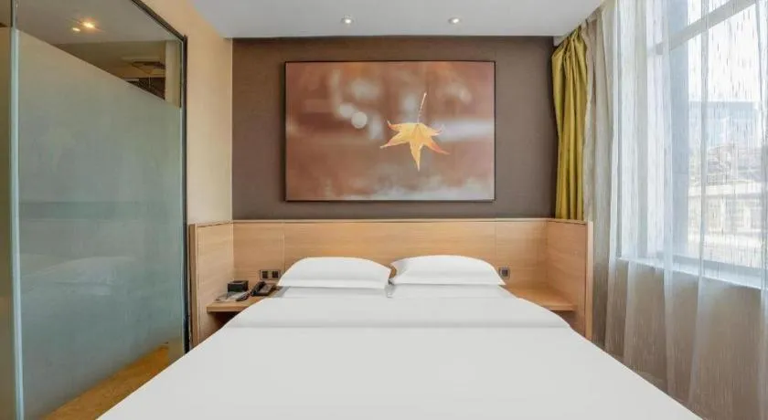 Bed in IU Hotels Xinzhou Bus Terminal