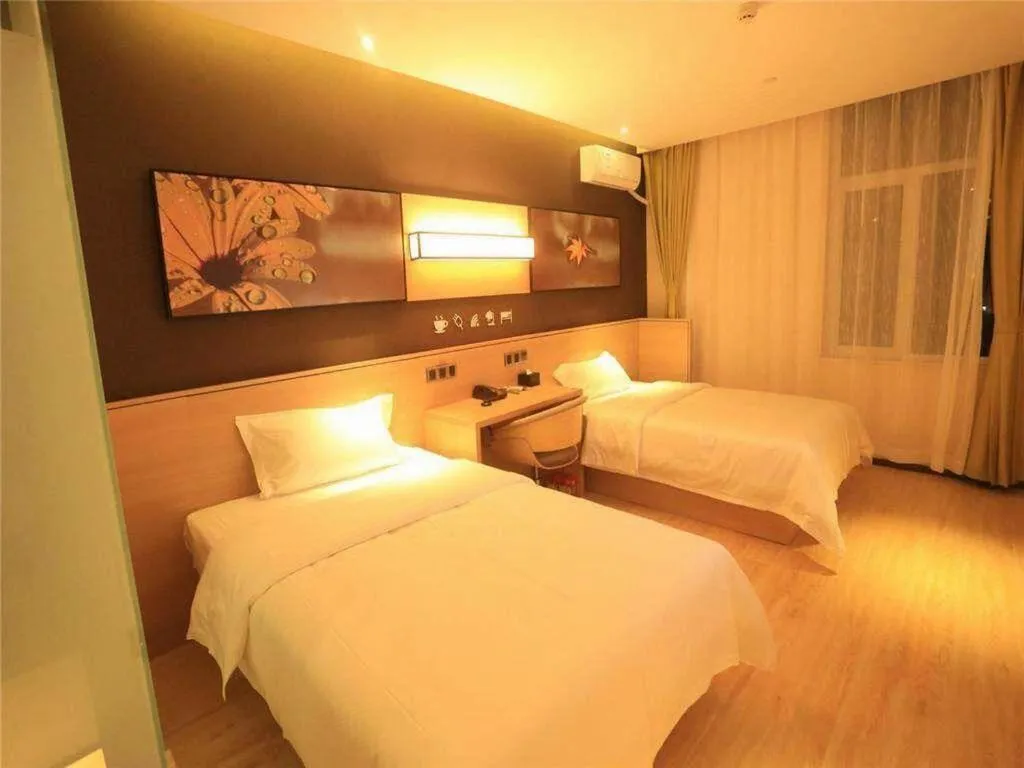 Bed in IU Hotels Xinzhou Bus Terminal
