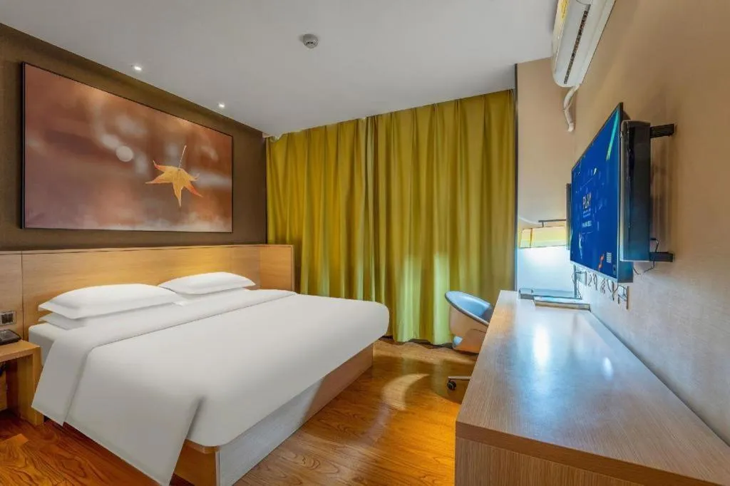 Bed in IU Hotels Xinzhou Bus Terminal