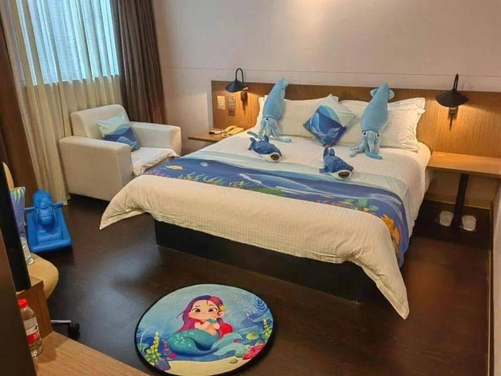 Bed in Magnotel Hotel Shanghai Railway Station Magnolia Plaza