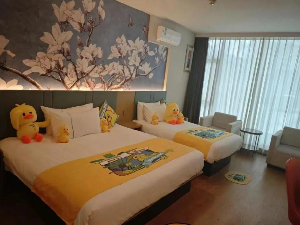 Bed in Magnotel Hotel Shanghai Railway Station Magnolia Plaza