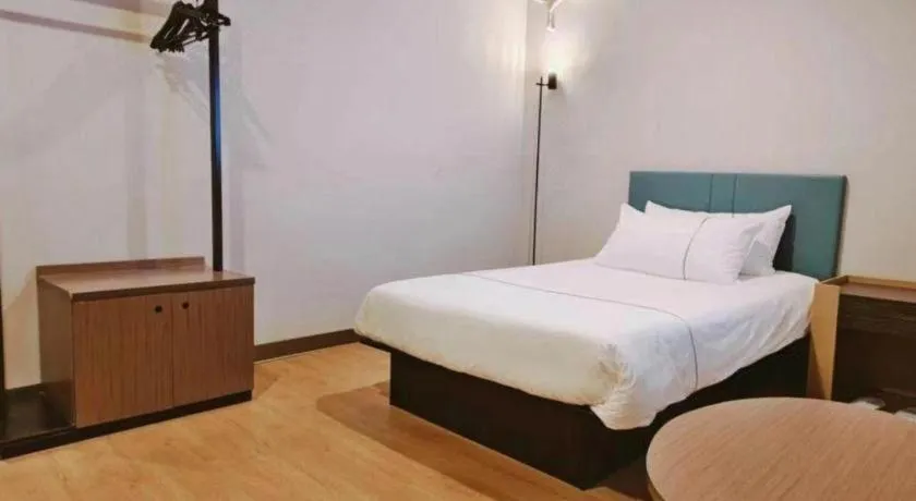 Bed in Magnotel Hotel Shanghai Railway Station Magnolia Plaza