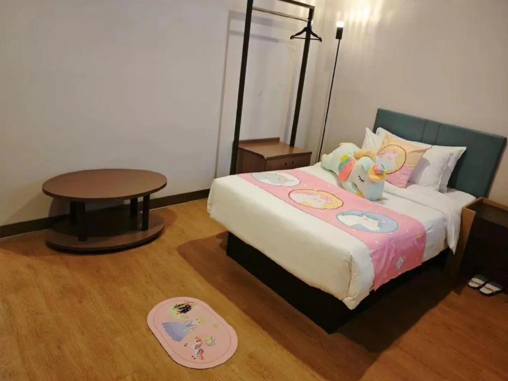 Bed in Magnotel Hotel Shanghai Railway Station Magnolia Plaza