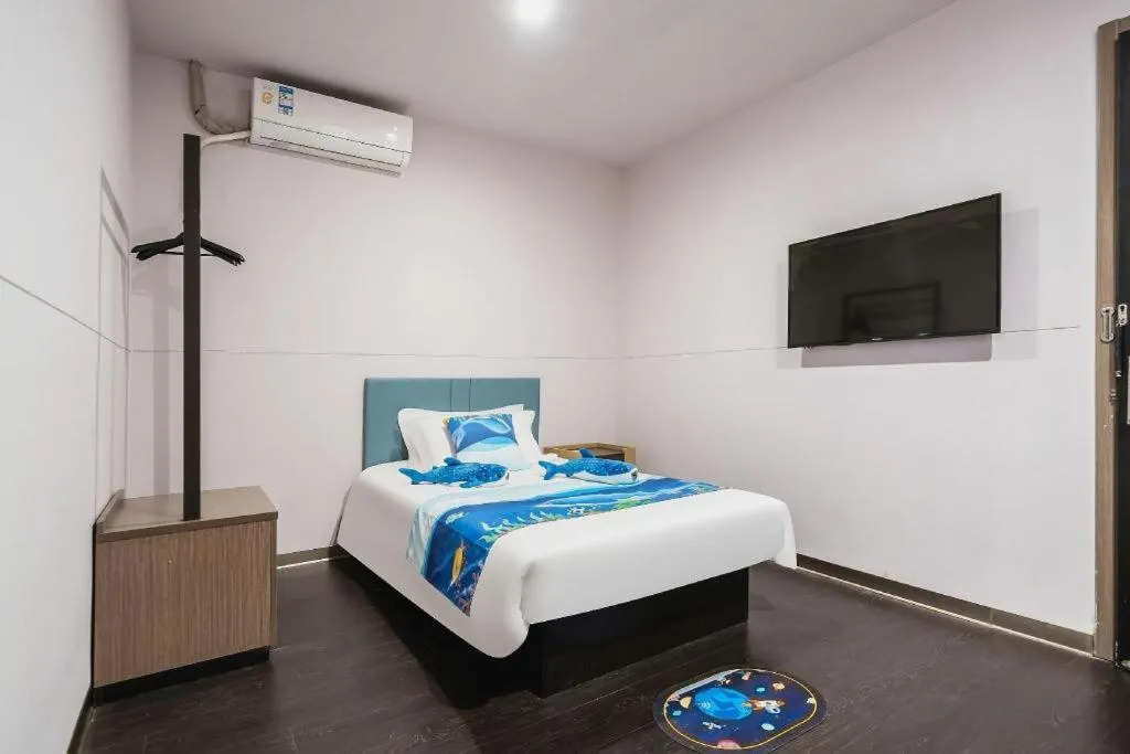 Bed in Magnotel Hotel Shanghai Railway Station Magnolia Plaza