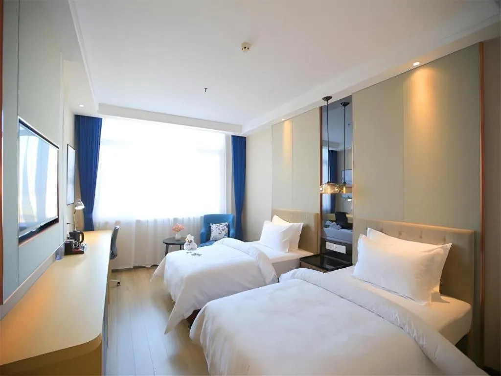 Bed in Jinjiang Metropolo Fuxin Yingbin Street Railway Station