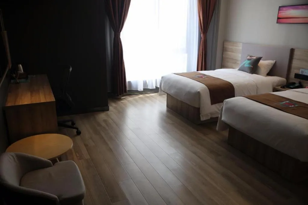 Bed in Pai Hotel Zhenjiang Railway Station South Square