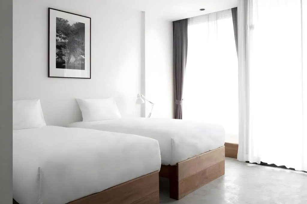 Bed in Rangsiya Boutique Hotel