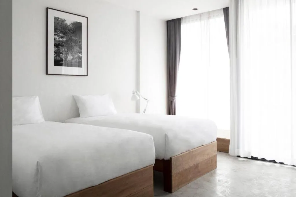 Bed in Rangsiya Boutique Hotel