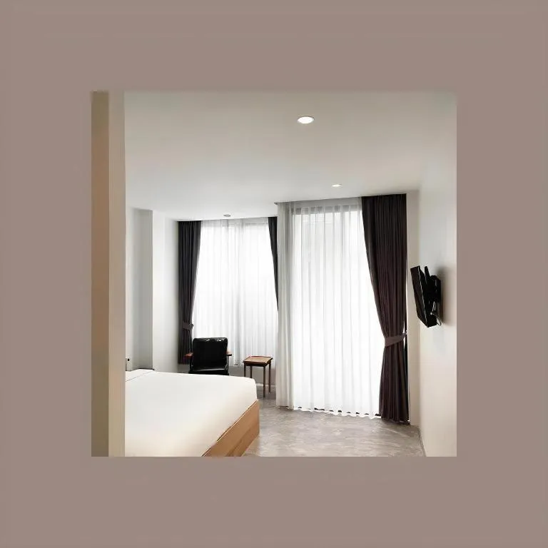 Bed in Rangsiya Boutique Hotel