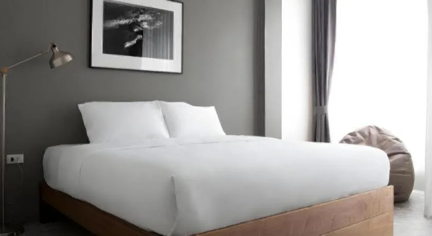 Bed in Rangsiya Boutique Hotel