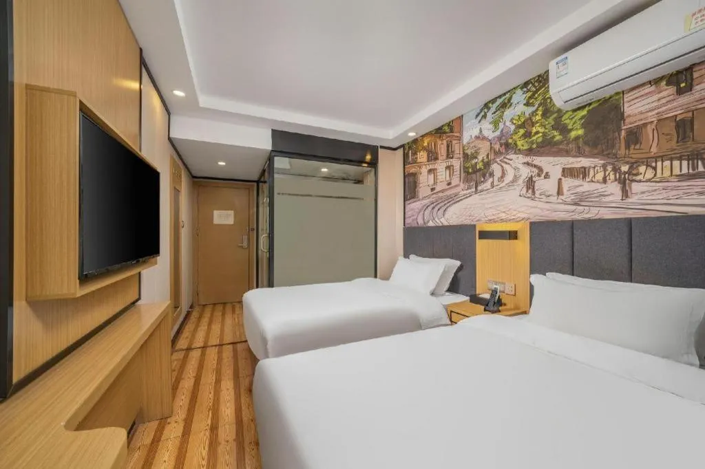 Bed in Yimi Hotel Guangzhou Sport College Branch