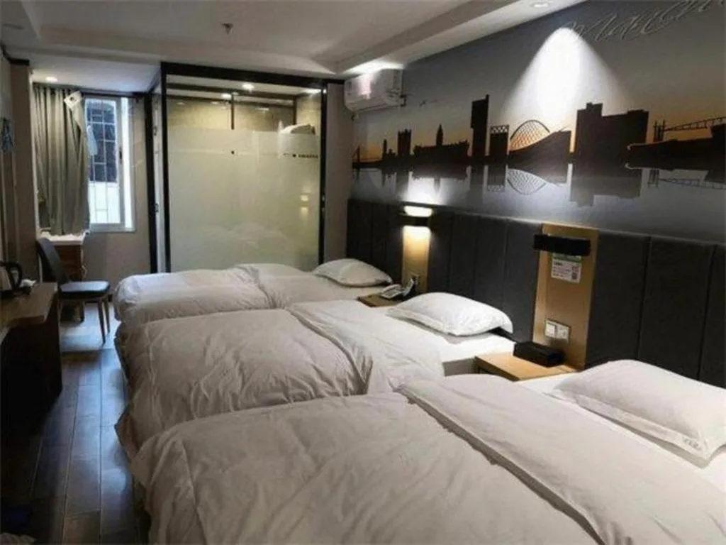 Bed in Yimi Hotel Guangzhou Sport College Branch