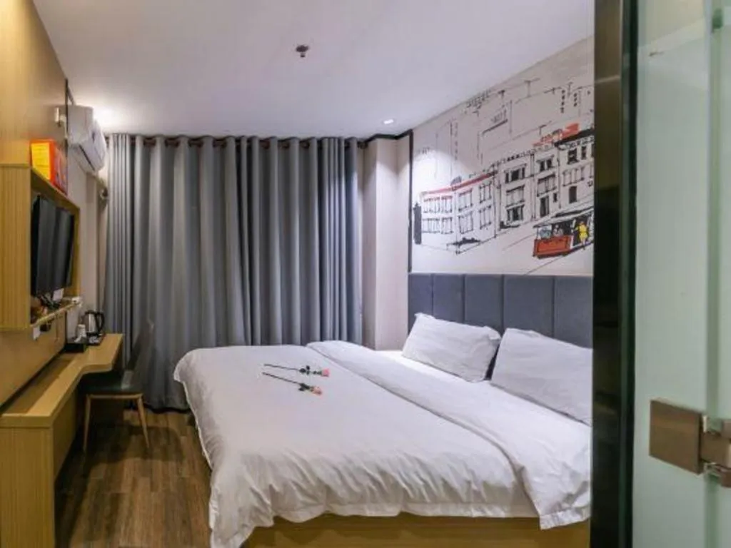 Bed in Yimi Hotel Guangzhou Sport College Branch