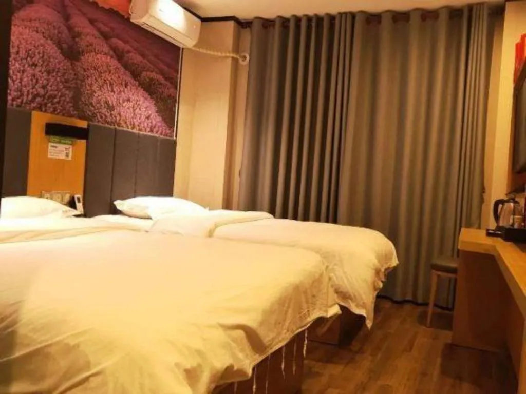 Bed in Yimi Hotel Guangzhou Sport College Branch