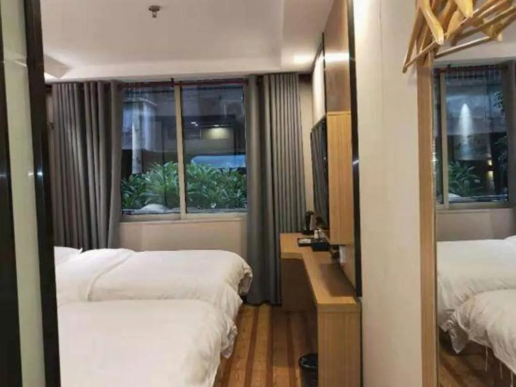 Bed in Yimi Hotel Guangzhou Sport College Branch