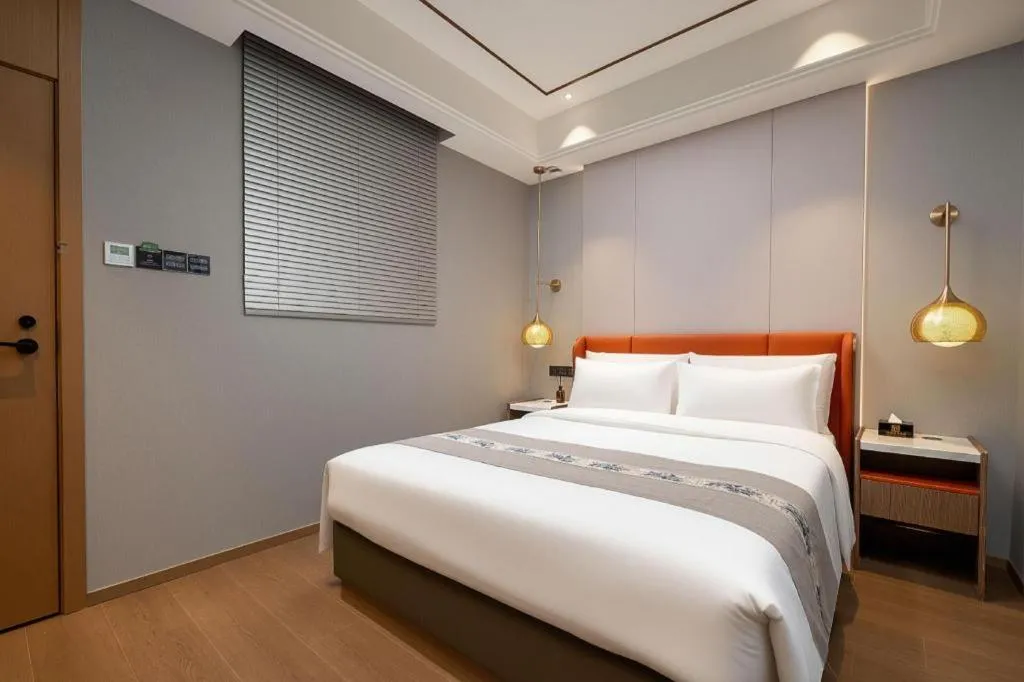 Bed in PAI Hotel·Chengdu Jintang Huaikou Huaizhou Avenue